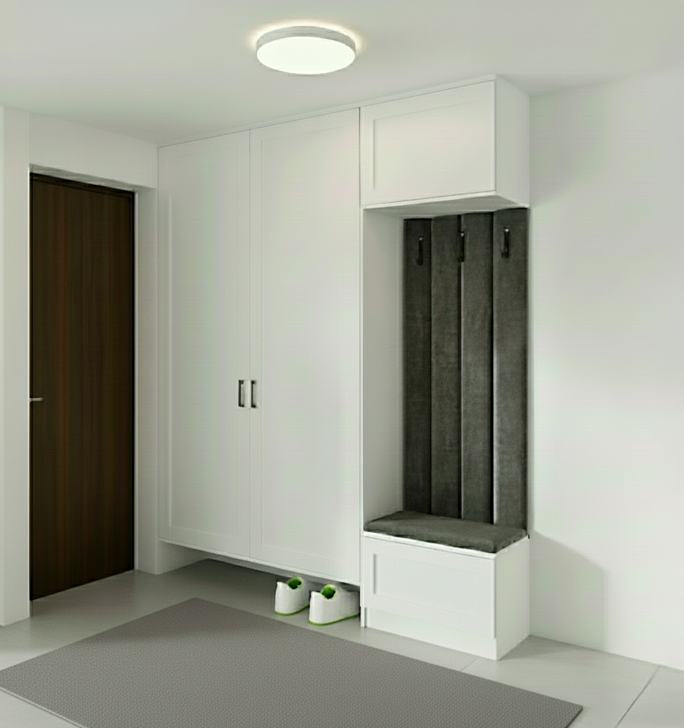 An incredibly lifelike, richly detailed, photorealistic interior photo of a bright and elegant hallway. The scene is illuminated by soft, natural light, creating a welcoming and serene atmosphere. Captured with a wide-angle lens, emphasizing the clean lines and contemporary design of the built-in cabinetry. The focal point is a large, white, panel-detailed wardrobe that spans much of the wall. To its right, a practical gray alcove features three sleek, metal coat hooks above a cushioned bench with a simple drawer beneath. The bench and drawer fronts are finished in a crisp white, mirroring the main wardrobe. The floor is laid with large, light-toned ceramic tiles, their subtle texture adding a touch of understated sophistication. Adjacent to the wardrobe is a dark, wood-grained door, providing a warm contrast to the otherwise neutral palette. The overall impression is one of modern utility with a hint of shabby chic charm, though the overall aesthetic leans towards a clean, minimalist sensibility within a kitchen or entryway context.