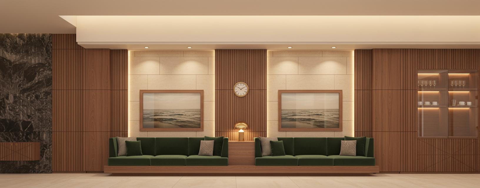 An incredibly lifelike, richly detailed, photorealistic floorplan of an elegant lounge within a premium shop occupying an exhibition space with vintage overtones. The scene is illuminated by warm, subtle ambient light emanating from concealed ceiling coves, creating a sophisticated and inviting atmosphere with no hint of natural light. This high-angle, dollhouse-esque perspective emphasizes the meticulous design and luxurious materials; predominantly American walnut walls with vertical slats contrast beautifully with the smooth, light travertine tiled floor. Dominating the central space are two deep, forest-green velvet sofas, each adorned with four smaller matching velvet cushions, arranged symmetrically and divided by an American walnut platform topped with a small brass table lamp. Behind each sofa, a large rectangular picture frame, framed in light wood, is recessed within a travertine cove, displaying serene ocean motifs, their surfaces subtly reflecting the warm interior light. To the left, divided from the center lounge by an American walnut wall, a sliver of an adjacent room is visible, characterized by a striking wall panel of dark, veined marble and a small console attached to said wall. To the right, separated by another American walnut wall, the lounge transitions into a bar area, featuring sleek, glass-fronted cabinets with illuminated shelves displaying elegant glassware, further enhancing the sense