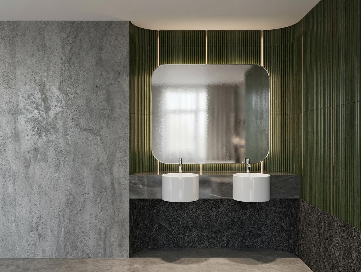 An incredibly lifelike, richly detailed, photorealistic interior photo of a hotel bathroom set in a contemporary, elegant environment. The scene is illuminated by soft, diffused lighting that highlights the sophisticated materials and creates a serene atmosphere. Captured with a wide-angle lens, emphasizing the clean lines and luxurious textures of the space. The dominant feature is a large, gracefully curved wall clad in vertical, dark green bamboo-like elements, interspersed with subtle vertical light strips that impart a gentle glow. Centered within this feature wall is a generously sized, rounded rectangular mirror with a frosted finish, reflecting a soft, diffused light. Below the mirror, a sleek grey stone counter anchors the design, featuring two pristine white cylindrical fixtures, possibly faucets or decorative elements, adding a touch of minimalist charm. Beneath this counter, a textured, dark charcoal base, with an almost organic, fibrous appearance, grounds the composition. To the left, a substantial wall finished in a rough, textured grey material, reminiscent of polished concrete, provides a bold contrast to the delicate bamboo. The overall impression is one of modern sophistication and understated luxury, where natural textures meet clean, contemporary design.