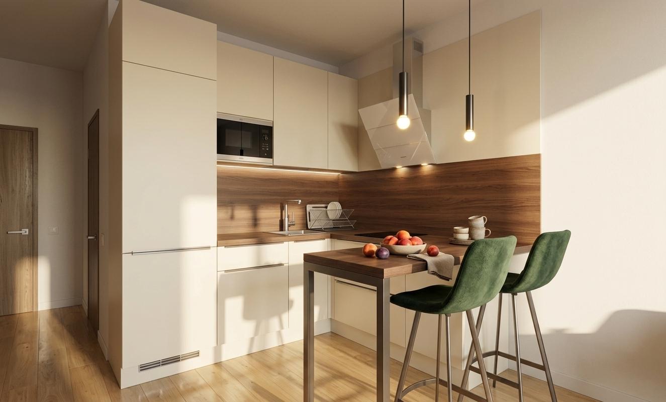 An incredibly lifelike, richly detailed, photorealistic interior photo of a contemporary kitchen set in a sun-drenched summer morning. The scene is illuminated by soft, warm light spilling in from an unseen window, enhanced by subtle under-cabinet task lighting and a gentle glow emanating from the minimalist overhead extractor hood, creating a serene and inviting atmosphere. Captured with a wide-angle lens, emphasizing the clean lines of the pale cream cabinetry that contrasts beautifully with the rich, dark wood veneer accentuating the backsplash and breakfast bar. Two sleek, modern pendant lights with thin metal stems descend gracefully above the breakfast bar, casting a focused light on its warm wood surface, which is complemented by the deep green upholstered bar stools. Minimalist accessories, such as a slim stainless steel faucet and discreet drawer pulls, further enhance the sophisticated, uncluttered aesthetic. Recessed ceiling spotlights strategically placed throughout the kitchen add another layer of practical illumination. The polished wooden floor reflects the light, adding a touch of warmth to the overall sophisticated design, and the shadows cast by the window add depth and realism to the space.