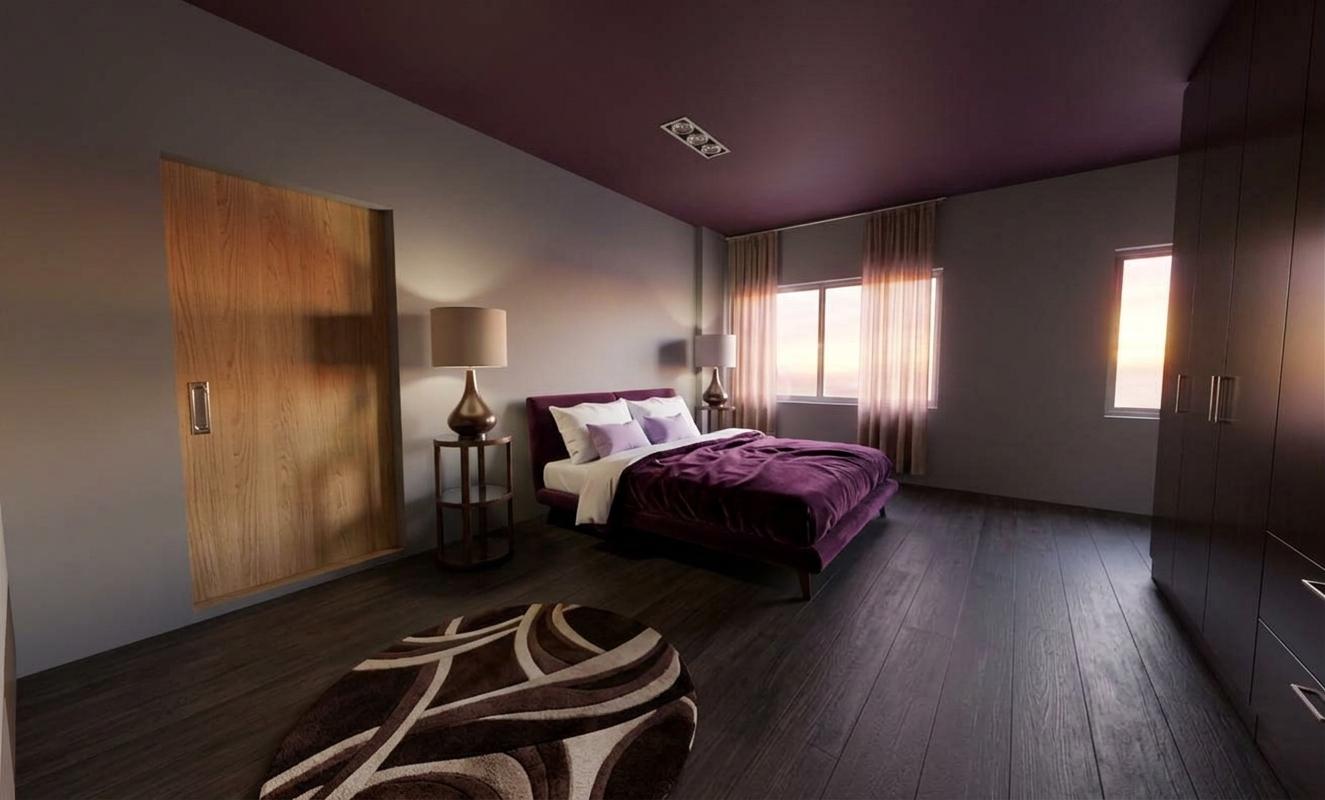 An incredibly lifelike, richly detailed, photorealistic interior photo of a luxurious bedroom, bathed in the soft, warm glow of a sunrise peeking through sheer curtains. The scene evokes Victorian elegance with its sophisticated palette and plush furnishings. The walls are a sophisticated mid-tone gray, providing a serene backdrop for the deep plum-colored ceiling that adds an unexpected touch of dramatic richness. Contrasting this, the floor is laid with dark, wide-plank wood, its subtle grain lending a tactile quality that grounds the opulent atmosphere. A substantial bed, draped in a rich, jewel-toned purple duvet and accented with crisp white and soft lavender pillows, sits as the room's centerpiece. On either side, elegant bedside tables hold classic lamps with tapered shades, their bases echoing the curvilinear forms of lamps on the far side of the bed. The room is furnished with a sliding wooden door on the left, its natural grain adding warmth, and a large, dark wardrobe to the right, its smooth, monolithic presence hinting at ample storage. A circular rug with an abstract, swirling pattern of deep browns and creams gracefully grounds the central area of the room, tying together the color scheme. The soft, diffused light of dawn filters through the windows, casting gentle shadows and highlighting the textures of the fabrics and wood, creating an intimate and serene ambiance.