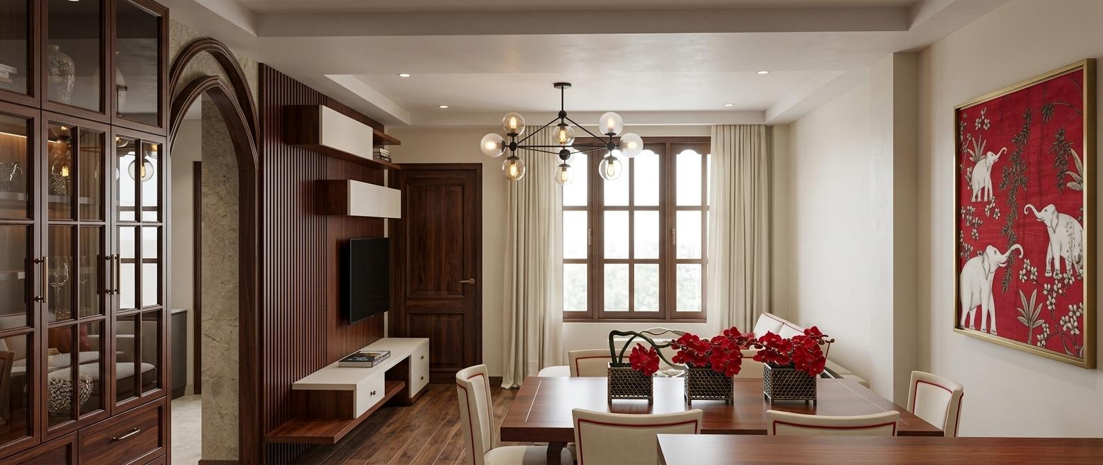 An incredibly lifelike, richly detailed, photorealistic wide-angle interior shot of a sophisticated living and dining area showcasing Indian exuberance, set in a luxury urban residence. The scene is illuminated by soft, diffused daylight filtering through floor-to-ceiling ivory curtains and the warm, ambient glow of a contemporary black sputnik chandelier with frosted glass globes, creating a refined and welcoming atmosphere. Captured with a 24mm wide-angle lens, emphasizing the contrast between the deep wood grains and the vibrant cultural accents, the composition features an ornate dark wood cabinet with an elegant pointed archway that leads into an adjacent space. The center of the room is anchored by a polished mahogany-toned dining table topped with striking red floral centerpieces in textured black baskets, surrounded by modern white chairs with bold red piping. To the left, a minimalist TV console with staggered white and wood modules sits beneath a large screen, while on the right, a large-scale piece of vibrant wall art depicting white elephants on a rich crimson background serves as a focal point, celebrating the room's heritage-inspired theme. Every finish, from the smooth matte plaster of the tray ceiling to the intricate paneling of the solid wood door, is rendered with tactile precision, highlighting the spatial depth and the harmonious blend of traditional craftsmanship and modern design.