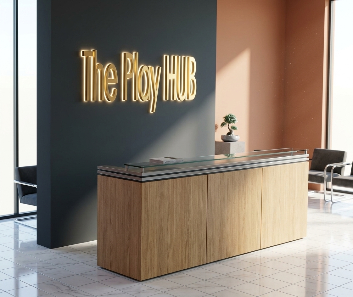 An incredibly lifelike, richly detailed, photorealistic interior photo of a modern hotel reception lobby set in a futuristic techno wonderland. The scene is illuminated by bright, direct midday summer sunlight coming from large unseen windows, beautifully balanced with a soft, warm LED halo glowing from behind the custom dimensional letters of "The Play HUB" sign, creating a vibrant, premium, and sophisticated atmosphere. Captured with a 24mm architectural tilt-shift lens, emphasizing the expansive, seamless surface of the glossy large-format white porcelain floor tiles and the pristine vertical grain of the oak-veneer reception counter, the shot features elegant, minimalist waiting chairs nearby designed with sleek chrome frames and plush charcoal upholstery. The deep matte-gray feature wall provides a striking backdrop for the illuminated gold lettering, while the soft terracotta accent wall to the side adds organic warmth, reflecting subtle golden gleams onto the highly polished floor beneath, completing this meticulously styled hospitality space.