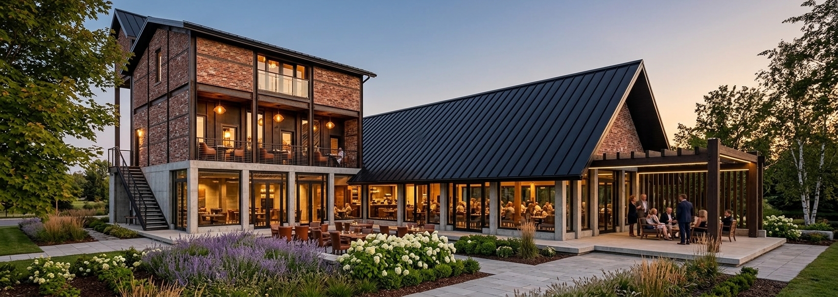 An incredibly lifelike, richly detailed, photorealistic wide-angle architectural photograph of a modern industrial-loft style restaurant set in a beautifully curated garden landscape. The scene is illuminated by the soft, golden light of twilight, creating a warm, inviting, and highly sophisticated atmosphere. Captured with a professional 24mm tilt-shift lens, emphasizing the rich textures of rustic red bricks, polished concrete columns, and expansive floor-to-ceiling glass facades. Inside the sprawling dining spaces, warm internal pendant lights cast a cozy glow, highlighting stylish wooden dining tables, leather-upholstered chairs, and bustling patrons enjoying their evening. On the left, the two-story wing features an elegant attic space with glass-accented Juliet balconies above the ground-floor entrance. To the right, a long pavilion wing with a sleek black pitched roof opens onto a concrete patio, complete with a minimalist pergola structure where guests unwind under subtle, integrated external spotlights. Beautifully manicured garden beds overflowing with lavender, white hydrangeas, and ornamental grasses border the pristine pathways, while mature maple and birch trees frame the property, grounding this contemporary culinary destination in a serene, nature-infused setting.