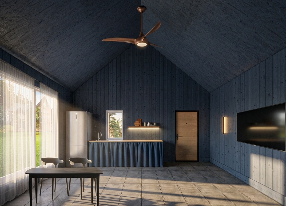 A wide-angle interior photograph of a modern vaulted cabin during a warm spring sunset, captured with a professional camera using a prime lens. The camera maintains a straight-on perspective, looking down the space to showcase the deep indigo-blue stained wood-paneled walls and matching rough-textured ceiling. Warm, low-angled golden sunset light streams in through the large glass sliding doors on the left, casting long, soft-edged shadows across the matte slate-gray tiled floor and illuminating the sheer white curtains. Inside, cozy artificial lighting complements the sunset atmosphere: a warm under-shelf LED glow highlights wooden serving boards and canisters, a slim wall sconce casts a soft amber light on the right wall, and the light from the copper ceiling fan softly illuminates the center of the room. The materials are rendered with exquisite, tactile realism, from the subtle grain of the light-colored wooden door and the rich texture of the blue under-counter curtain fabric, to the matte plastic chairs, black dining table, and sleek metallic refrigerator. Through the window, the outdoor view reveals a lush green spring pine forest and neighboring cabins bathed in the fading orange and pink colors of dusk, creating a serene, lived-in atmosphere complete with subtle photographic details like faint lens bloom, natural color grading, and organic surface imperfections.
