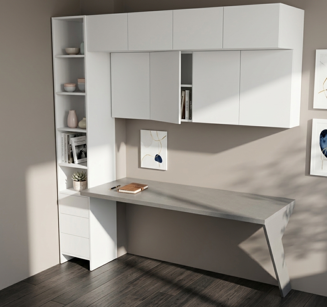 An incredibly lifelike, richly detailed, photorealistic eye-level interior photo of a minimalist haven study room set in an elegant contemporary home. The scene is illuminated by bright, direct midday summer sunlight, creating a serene, calm, and uncluttered atmosphere. Captured with a 35mm prime lens, emphasizing the smooth matte white surfaces, refined gray countertop textures, and delicate shadow interplay... The architectural centerpiece features a custom-built, streamlined workspace with a sleek geometric angled leg, complemented by integrated upper wall cabinets and a tall vertical shelving unit finished in soft shades of white and modern muted gray. Within the open cubbies, a neatly organized collection of hardcover photography books, subtle pastel ceramics, and a small potted indoor plant introduce a touch of organic warmth to the monochromatic design. Set against smooth taupe walls with understated abstract wall art and resting on rich charcoal wood floorboards, the space exemplifies functional, zen-inspired elegance with pristine, clutter-free surfaces.