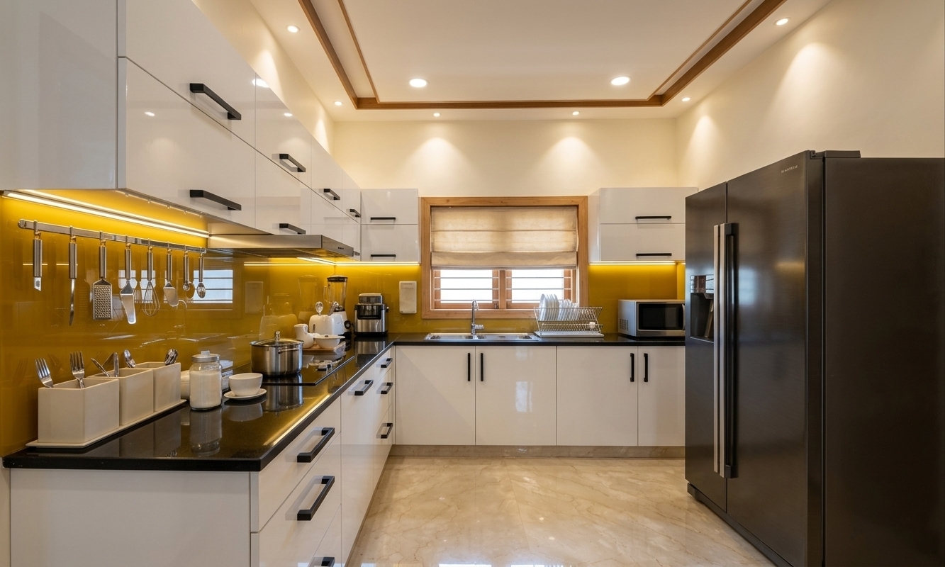 An incredibly lifelike, richly detailed, photorealistic interior photo of a sleek retro-futuristic kitchen set in a contemporary residence. The scene is illuminated by warm recessed spotlights and vibrant under-cabinet LED strip lighting during bright midday, creating a bold, nostalgically futuristic atmosphere. Captured with a 24mm wide-angle architectural lens, emphasizing high-gloss reflective surfaces, metallic textures, and clean geometric lines...

The kitchen seamlessly combines space-age styling with mid-century elegance, featuring glossy white modular cabinetry adorned with sharp black linear handles, set against polished jet-black countertops. A striking mustard-yellow glass backpanel introduces a vibrant, neon-inspired contrast along the wall, beautifully reflecting hanging stainless steel utensils and streamlined culinary gadgets. To the right, a substantial dark metallic double-door refrigerator anchors the space, while a central wooden-framed window fitted with a soft beige Roman shade frames the sink area. Overhead, a tray ceiling with warm wood trimming complements the smooth, highly reflective cream-and-beige marble flooring, creating a polished, space-age haven filled with subtle retro charm.