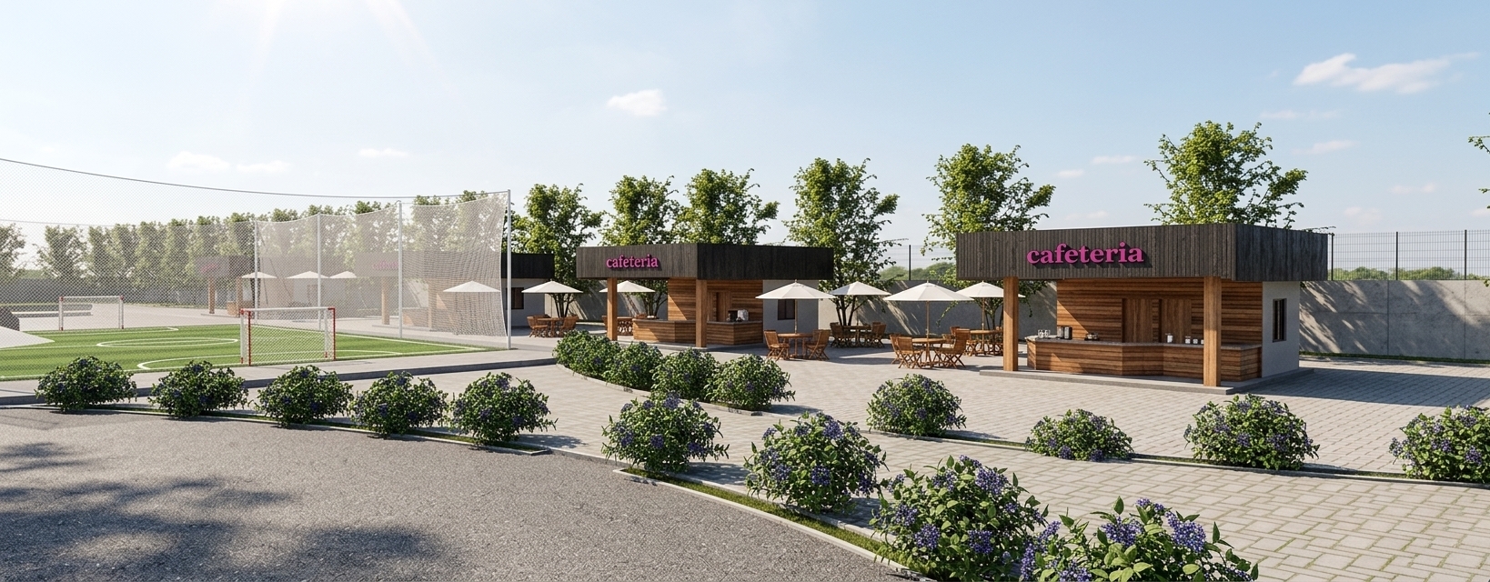 A photorealistic bright daylight photograph of the outdoor leisure complex under the high, intense sun of a clear summer midday, casting crisp, sharp shadows straight onto the ground. The warm sunlight illuminates the horizontal wooden cladding on the cafeteria kiosks, revealing natural timber grain, realistic knot details, and polished wooden counters beneath the pink neon signage. White fabric patio umbrellas display natural woven textures and soft creases, shading wooden outdoor tables and chairs set upon interlocking stone paver walkways. To the left, the synthetic green turf field features crisp painted lines, enclosed by fine white netting strung between steel posts, with detailed soccer goals resting on the pitch. The foreground features dark asphalt with fine aggregate texture and concrete curb edges, bordered by lush green landscaping bushes with tiny purple blossoms, while dense, fully leafed summer trees form a vibrant green backdrop. Captured with a professional wide-angle architectural lens, maintaining flat horizon geometry and perfect perspective, with subtle natural lens vignetting and micro-imperfections across all surfaces.