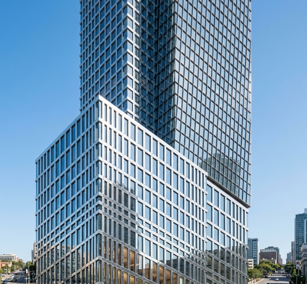 An incredibly lifelike, richly detailed, photorealistic low-angle architectural shot of a soaring skyscraper tower set in an ambitious metropolitan landscape. The scene is illuminated by bright, clear daylight under a cloudless azure sky, creating a sophisticated and vibrant atmosphere. Captured with a professional architectural tilt-shift lens, emphasizing the shimmering silver reflective mullions, razor-sharp geometric grid structures, and mirror-like exterior textures... 

The modern fusion design seamlessly combines stacked rectangular volumes, featuring high-reflection glass facades framed by light silver mullions that glint under the sunlight and mirror the surrounding sky with pristine clarity. Beyond the reflective glass exterior, warm, welcoming ambient interior lighting softly illuminates high-end meeting rooms and executive suites, featuring modern fusion wood-and-metal finishes and sleek conference furniture that add a touch of human scale and elegance to the towering structural facade.