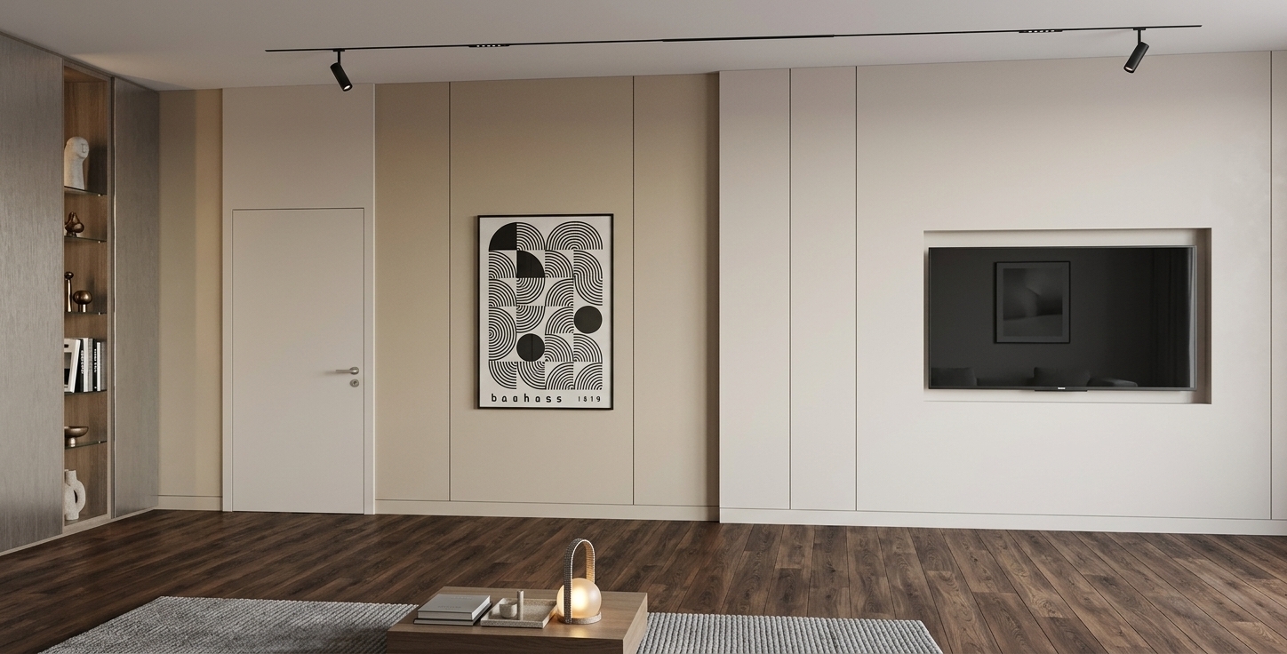 An incredibly lifelike, richly detailed, photorealistic eye-level interior shot of a refined living and home office lounge set in a serene contemporary residence. The scene is illuminated by minimalist ceiling-mounted magnetic track lights and the gentle, warm glow of a designer portable lantern, creating an airy, calm, and sophisticated atmosphere. Captured with a professional 35mm prime lens, emphasizing the velvety matte texture of warm champagne and pearl wall panels, the deep grain of rich dark hardwood flooring, and the sleek finish of a recessed television display. On the wall, a framed monochrome Bauhaus art print adds a graphic touch of modern elegance, balanced by a tall built-in niche shelving unit showcasing curated sculptural artifacts and hardbound photography books. In the foreground, a tailored low-profile coffee table resting on a ribbed soft gray area rug grounds the balanced, clean-lined interior.