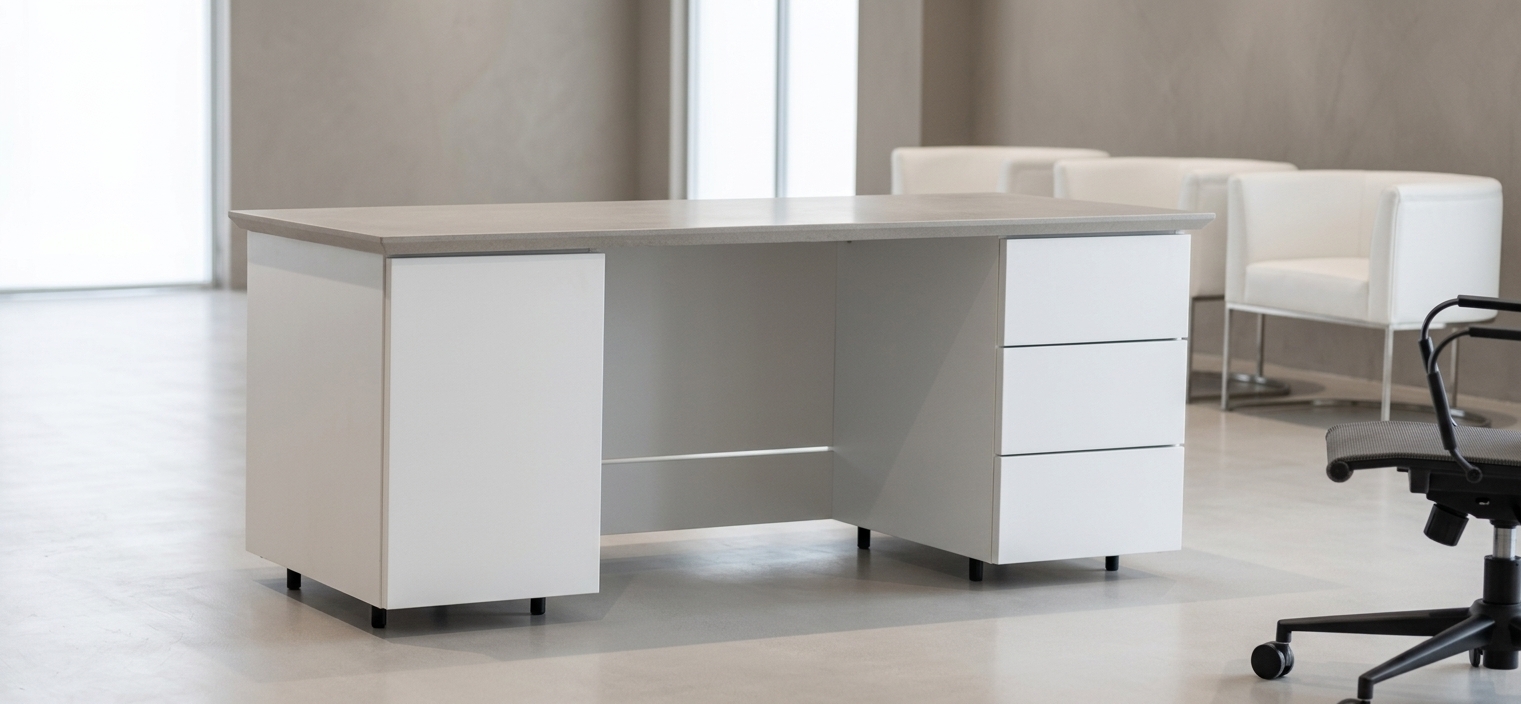 An incredibly lifelike, richly detailed, photorealistic eye-level interior shot of an executive workstation set in a high-end, modern minimalist corporate office. The scene is illuminated by soft, diffused daylight balanced by subtle ambient recessed lighting, creating a bright, serene, and professional atmosphere. Captured with a 50mm architectural lens at f/2.8 with a shallow depth of field, emphasizing the tactile textures of matte stone, smooth satin laminates, and powder-coated steel. The focal executive desk showcases a solid, finely beveled countertop resting atop structured pedestal units—featuring a clean-faced cabinet on the left, a recessed modesty panel in the middle, and three stacked pull-out drawers on the right, all slightly raised on discreet matte-black cylindrical legs. In the softly blurred background, tailored white leather tub chairs on brushed steel bases rest against a neutral warm-gray wall, while a sleek ergonomic task chair occupies the foreground corner over pristine, polished micro-cement flooring with soft, realistic contact shadows.