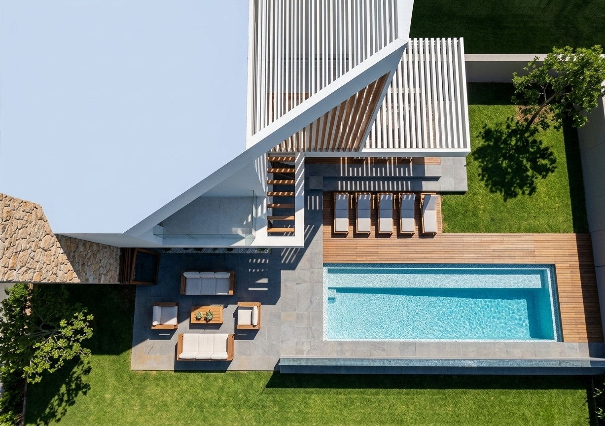An incredibly lifelike, richly detailed, photorealistic top-down architectural aerial shot of a modern fusion backyard and outdoor pool area set in a luxury private residence. The scene is illuminated by brilliant midday summer sunlight, casting crisp, geometric shadows that create a vibrant and tranquil resort-style atmosphere. Captured from an elevated perspective with a high-resolution camera, emphasizing the natural grain of the warm timber decking, the shimmering crystal-clear water of the rectangular swimming pool, and the lush green texture of the manicured lawn framed by leafy trees. Architectural elements like the sleek white slatted pergola, textured stone feature wall, and cleanly arranged outdoor lounge seating and sun loungers come together seamlessly to define a sophisticated, minimalist outdoor living sanctuary.