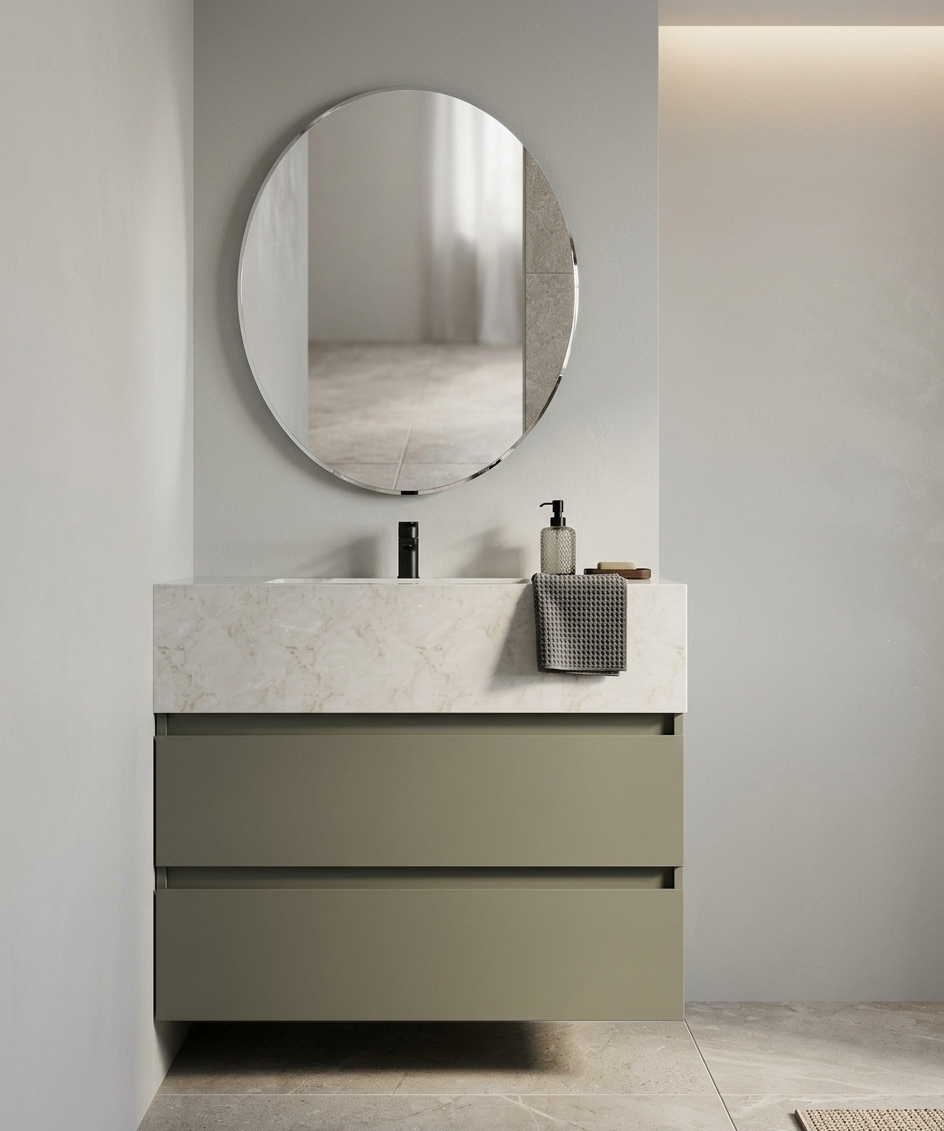 A front-facing interior architectural photograph of the minimalist bathroom vanity, precisely maintaining the straight-on composition and geometry. The oval mirror reflects the room with clear, realistic glass depth and soft specular highlights. The thick marble countertop displays realistic delicate veining, housing a polished chrome faucet alongside a few tasteful, neatly placed accessories including a modern soap dispenser, a small folded towel, and a tiny ceramic vase. The two-tier matte grey vanity drawers show precise shadow gaps and subtle surface texture. Diffused warm ambient lighting softly illuminates the neutral matte wall and tiled floor, captured with crisp focus, balanced dynamic range, and authentic material physics.