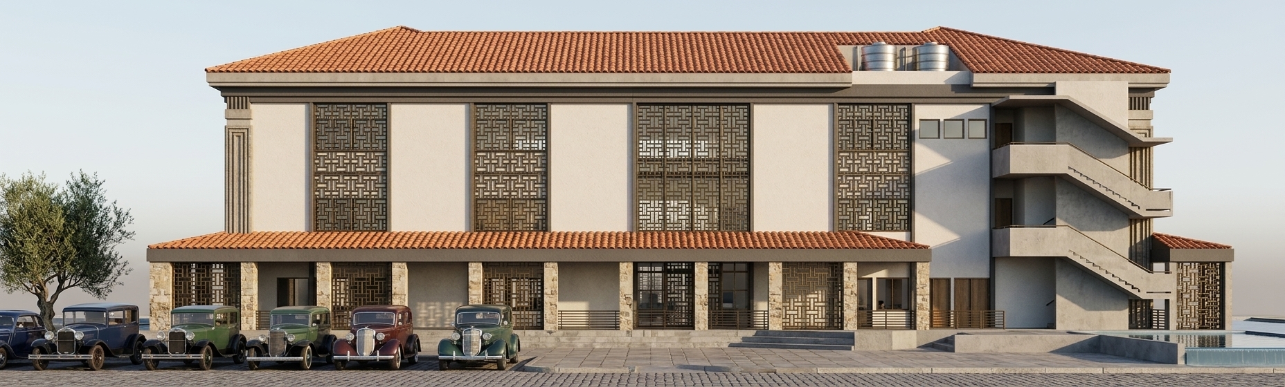 The photo presents a detailed architectural rendering of a multi-story building, depicted under clear, bright daylight against a pristine white background. The structure exhibits a distinctive fusion of contemporary lines with traditional or regional design elements, perhaps influenced by a modern tropical aesthetic with subtle nods to mid-century modern principles in its clean massing and functional emphasis. The building is crowned by a striking reddish-orange hip roof with generous dark grey eaves, providing deep shade. Its main facade, viewed from a slight angle, features two stories. The upper floor is predominantly white, punctuated by expansive window bays fronted with intricate dark, geometric patterned screens. These screens, suggestive of a traditional lattice or mashrabiya, offer both privacy and filtered light, hinting at comfortably shaded interior spaces, perhaps designed as expansive **living rooms** that would benefit from this diffused illumination and natural ventilation, aligning with the mid-century modern emphasis on natural light. The ground floor beneath the prominent overhang consists of a series of robust dark grey columns supporting the upper level, creating an inviting, open-air porch or circulation area. This lower level also incorporates similar dark patterned screens and smaller windows, suggesting a blend of open and semi-enclosed spaces. On the right side, a series of exposed white staircases with dark treads ascend to the upper floors, indicating functional access points and adding an asymmetrical, utilitarian contrast to the main facade's decorative elements. Materials appear to be a combination of smooth white walls, possibly stucco or concrete, offset by dark grey structural elements and trim, which underscore the building's horizontal lines, a common characteristic in mid-century modern design. The only visible landscaping elements are a simplified, grey-toned tree on the far left and a row of abstract, wireframe-like cars parked along the front, implying an urban or suburban setting. Two cylindrical mechanical elements, possibly water tanks or HVAC units, are visible on the roof, blending into the dark grey trim. The composition focuses sharply on the building, highlighting its architectural form, interplay of solids and voids, and the decorative yet functional nature of its patterned fenestration, suggesting a thoughtful approach to climate and human comfort within its design.