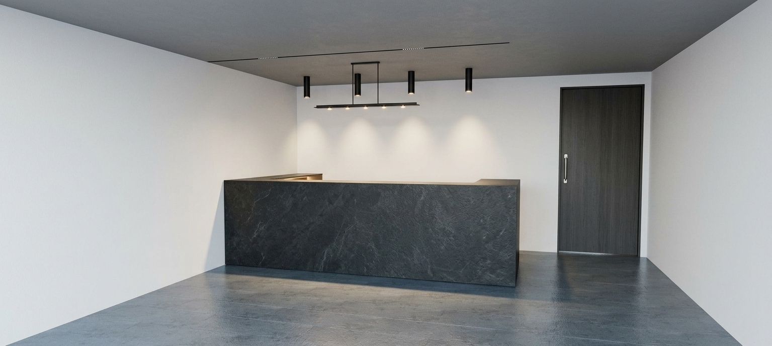 Photorealistic architectural photograph of the minimalist reception area, maintaining the exact layout, perspective, and geometry. The central reception desk is clad in premium matte black sintered stone with a refined tactile texture, highlighted by a subtle warm LED glow along its baseboard kickplate. The floor is composed of polished black marble featuring delicate veining and realistic specular reflections. Overhead pendant spotlights and a linear ceiling track cast focused, warm illumination downward, balancing the clean matte white walls and dark contemporary door. Captured with a sharp architectural lens, balanced exposure, soft ambient falloff, and natural contact shadows.