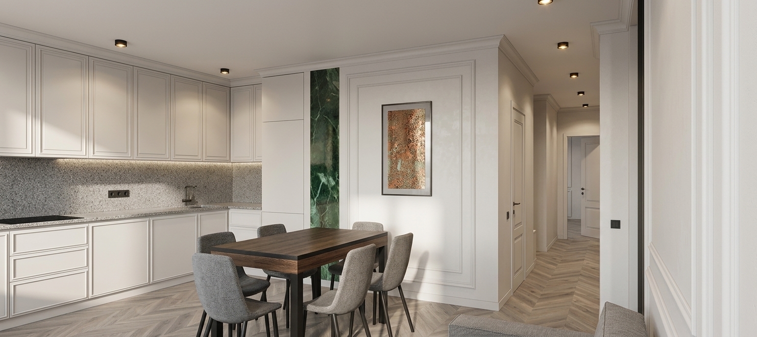 A wide-angle architectural photograph of the modern open-plan kitchen and dining area, preserving the exact geometry and composition. The scene is illuminated by soft, bright natural daylight and warm ceiling spotlights, casting gentle shadows. The walls and neoclassical wall moldings are finished in matching light off-white matte paint, highlighting subtle surface textures. The floor features realistic French chevron parquet in muted beige-gray tones with natural wood grain and satin reflections. Cabinetry features smooth off-white matte finishes with realistic metal seams, while the green marble vertical accent exhibits deep natural veining and a polished luster. The dining table and gray upholstered chairs show tactile fabric textures, captured with crisp depth of field and subtle lens vignetting.
