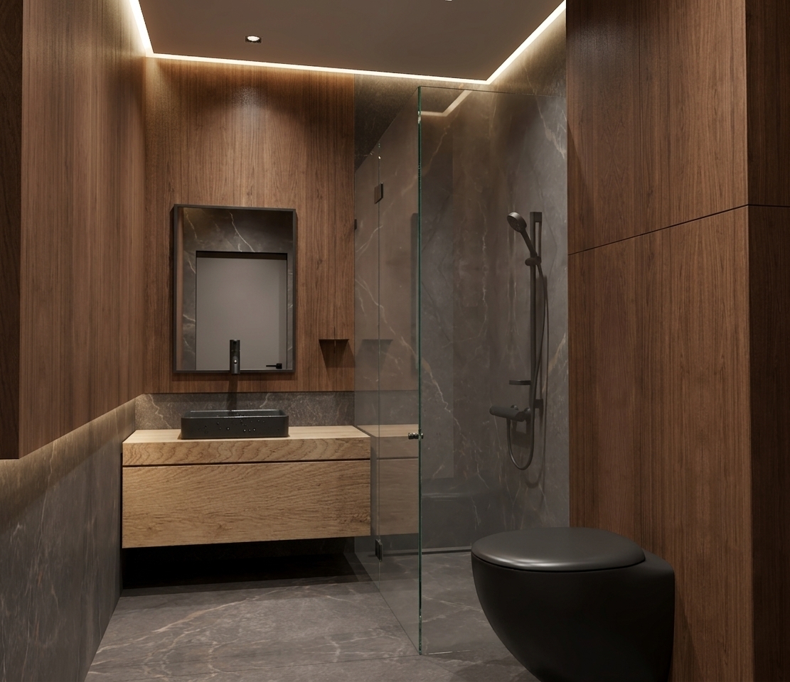 Architectural photograph preserving the exact geometry and layout of the modern bathroom, illuminated by soft, atmospheric overhead downlighting. Natural, tactile wood grain covers the vertical wall paneling and floating vanity, complementing the rich texture of the dark veined marble on the floors and shower interior. The matte black rectangular basin, sleek faucet, and foreground toilet show smooth, authentic surfaces, while the clear glass shower enclosure exhibits subtle reflections and transparency. Captured with a sharp architectural lens, emphasizing delicate ambient shadow gradients, realistic material physics, and a warm, moody interior atmosphere.