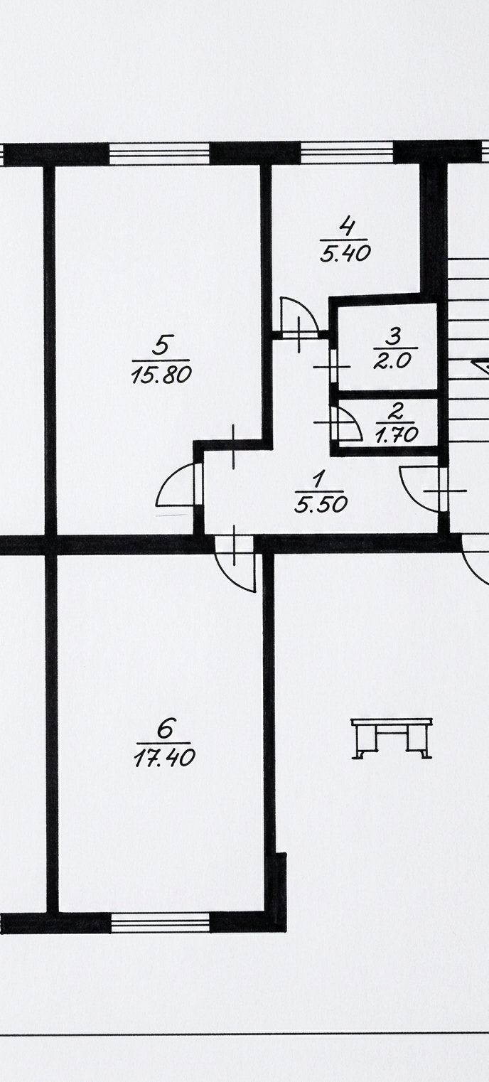 Top-down flat-lay photograph of this architectural apartment floor plan presented on crisp, bright white drafting paper. Solid black ink distinctly defines and fills all wall zones, preserving the exact layout and proportions while eliminating all dimension numbers and calculation markings in favor of clean room designations. Captured with a sharp 50mm macro lens under soft, diffused neutral studio illumination, highlighting subtle paper texture with edge-to-edge clarity and clean contrast.