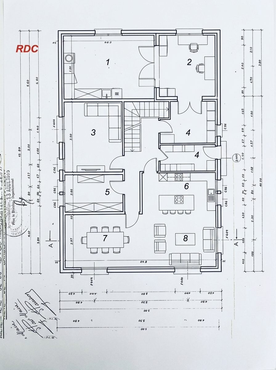 Generate a new 2D architectural floor plan redesign based on the provided floor plan layout, optimized for natural light:

- Relocate the staircase from its current position in zone 6 to a central location or towards the north side of the house, freeing up the southern side for bright living spaces.
- Zones 6 and 8: An open-plan modern kitchen featuring a large central kitchen island, connecting directly to a pantry/cellar (cellier) located in zone 4.
- Between zones 7 and 8: An open dining area with an 8-person dining table.
- Zone 8 / 7 open living area: A spacious, light-filled main living room lounge area.
- Zone 1: A dedicated laundry room (buanderie) on the north side, including an exterior access door leading outside.
- Zone 2: A formal entryway or home office / study room.
- Zones 3 and 5: Combined or configured into a cozy, intimate TV lounge / cocoon family room.
- Style: Clean, professional top-down 2D architectural blueprint layout, complete with standard architectural symbols for doors with swing arcs, windows, staircase steps, cabinetry, kitchen island, dining furniture, and sofas, presented as a clear black-and-white architectural technical drawing with wall outlines clearly delineated.
