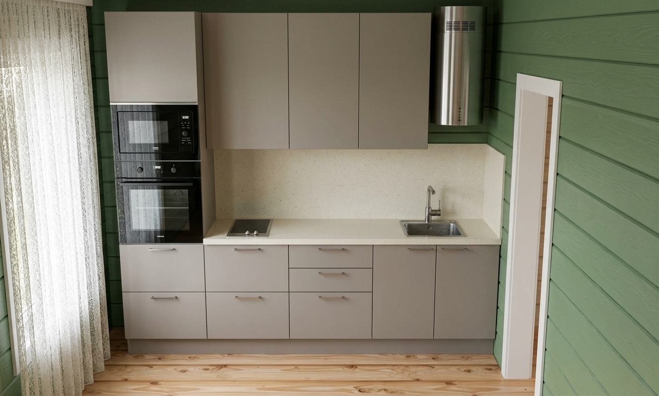 A straight-on interior architectural photograph of this compact kitchen, captured with a 35mm lens in soft, diffuse daylight filtering through the sheer curtain on the left. The scene features light green horizontal painted wood plank siding, matte taupe-beige cabinetry with subtle brushed metal handles, and a polished stainless steel sink and cylindrical range hood. The light pine floorboards display natural grain and faint sheen under ambient illumination. Glancing reflections appear on the black glass oven door, microwave panel, and glossy white tiled backsplash, complemented by gentle contact shadows along the plinth and under the wall-mounted cabinets for realistic depth.