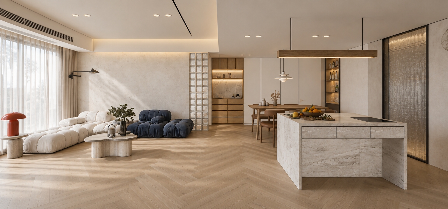 A professional architectural photograph of the open-concept modern living space, maintaining the exact layout, geometry, furniture placement, and perspective of the original image with straight, corrected vertical lines. Bright, diffused daylight flows naturally through the sheer drapery on the left, balanced by soft, neutral 4000K ambient recessed spotlights and integrated shelving illumination, casting soft contact shadows and realistic ambient occlusion throughout the interior. Surfaces display authentic, tangible materials: matte light-toned herringbone wood flooring with subtle grain variations, textured woven upholstery on the modular white and deep blue tufted sofas, honed white marble on the kitchen island with realistic veining, translucent textured glass blocks, and warm natural wood cabinetry. Captured with a full-frame camera on a wide tilt-shift lens, the image has balanced dynamic range, lifelike exposure roll-off from the windows, subtle depth of field, and a crisp, clean editorial finish free of over-processed HDR or synthetic artifacts.