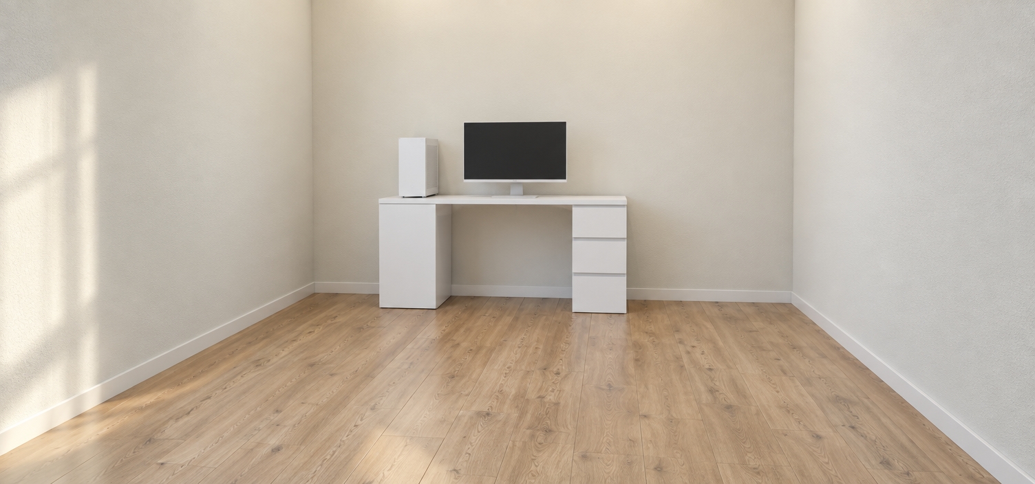 A clean architectural photograph capturing the exact room layout and camera perspective, featuring the minimalist desk rendered in a solid matte white finish. Positioned centrally on the tabletop is a sleek white computer monitor, accompanied by a matching white desktop PC tower placed on the left side, keeping the remaining surface completely clear. The surrounding walls show a subtle eggshell paint texture, and the floor features authentic light wood planks with gentle grain and soft specular reflections. Soft, diffused daylight illuminates the room naturally, casting realistic contact shadows and delicate ambient occlusion beneath the desk, captured with balanced exposure, sharp 35mm lens fidelity, and lifelike material textures.