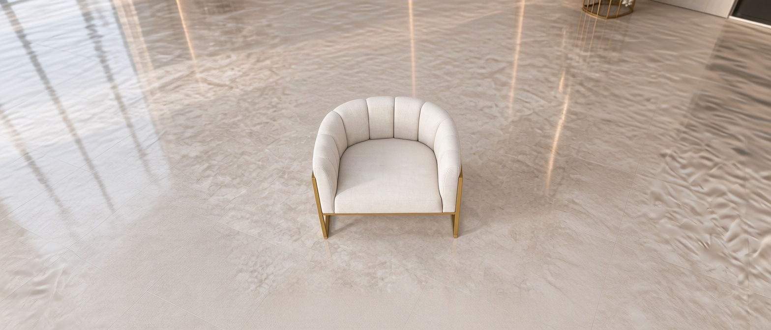 An incredibly lifelike, richly detailed, photorealistic studio shot of a pair of contemporary channel-tufted accent chairs set in a neutral, minimalist gallery space. The scene is illuminated by soft, diffused North-facing studio lighting, creating a clean, sophisticated, and high-end retail atmosphere. Captured with a Phase One XF IQ4 medium-format camera and an 80mm prime lens, emphasizing the crisp contrast between the brushed champagne-gold metal frames and the plush, off-white tactile fabric of the upholstery.
The chairs are positioned at a slight offset, showcasing the intricate vertical channel-stitching on the deep, curved backrests. The gold-finished sled bases feature a satin sheen, catching subtle highlights along the edges while casting soft, realistic contact shadows onto the light gray floor surface. Every stitch in the fabric is rendered with microscopic precision, revealing a subtle, high-quality linen weave texture that feels both luxurious and inviting. The camera’s depth of field is precisely calibrated to keep both pieces in sharp focus, while a gentle fall-off towards the background creates a sense of spatial depth. The composition is balanced and elegant, highlighting the geometric harmony between the rigid, structural metal frames and the soft, organic curves of the seating, presenting these pieces as if they were the centerpiece of a high-end luxury furniture catalog.